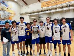 a group of boys who won a volleyball game