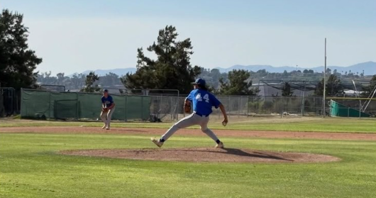 #44 Esteban Quintana pitches for the cavers